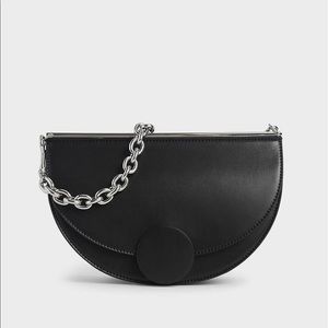 CHARLES AND KEITH HALF MOON BAG Used once still has tags